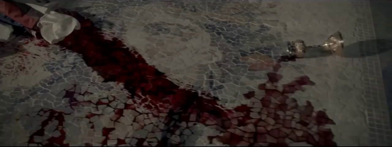 a bloody floor with a knife sticking out of it