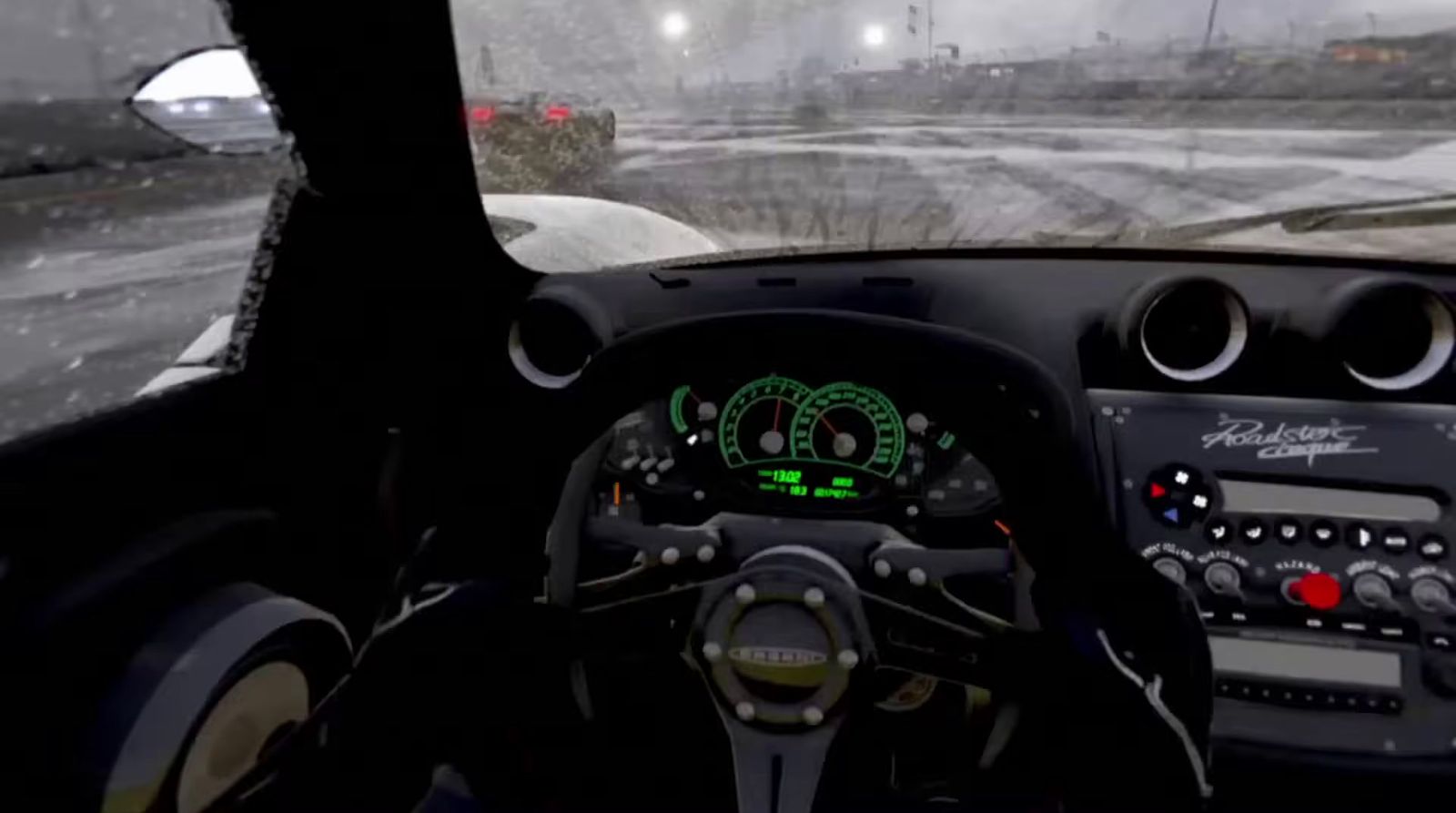 the dashboard of a car on a snowy road