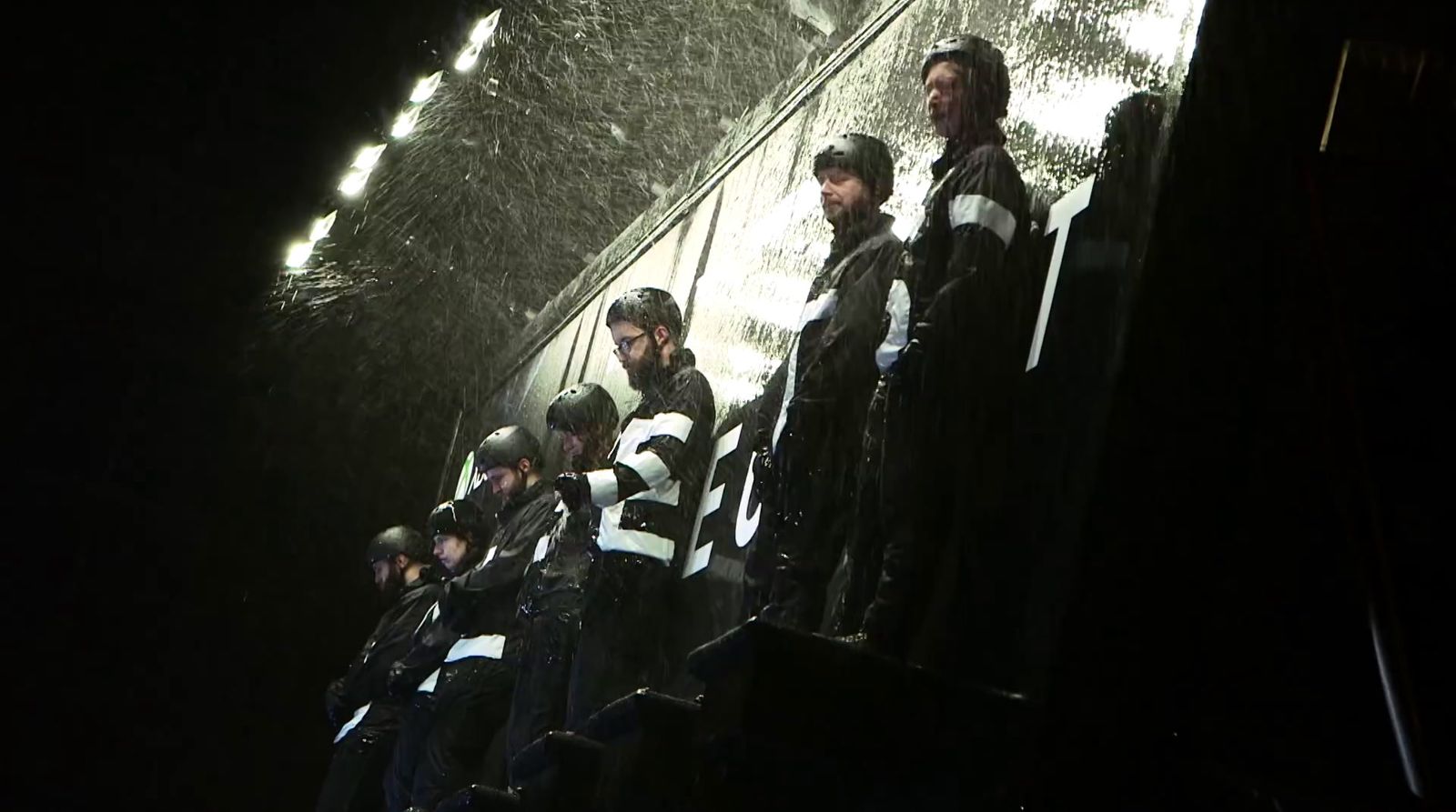 a group of men standing next to each other