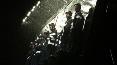 a group of men standing next to each other