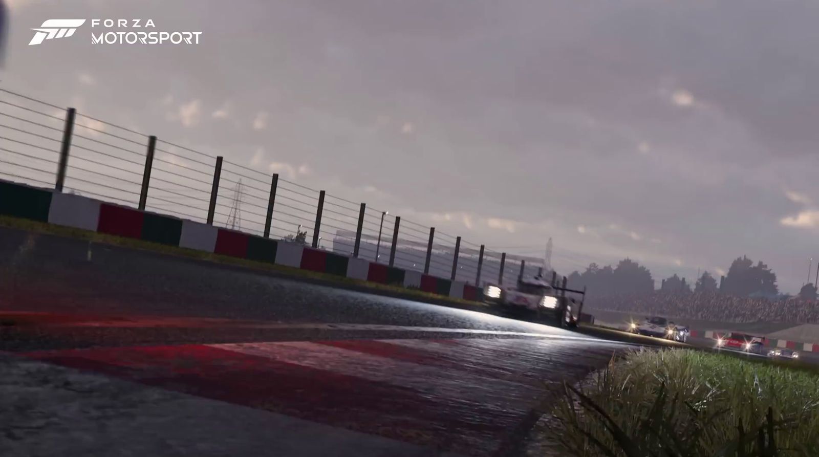 a screenshot of a race track with cars on it