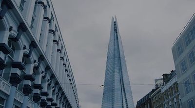 a very tall building towering over a city