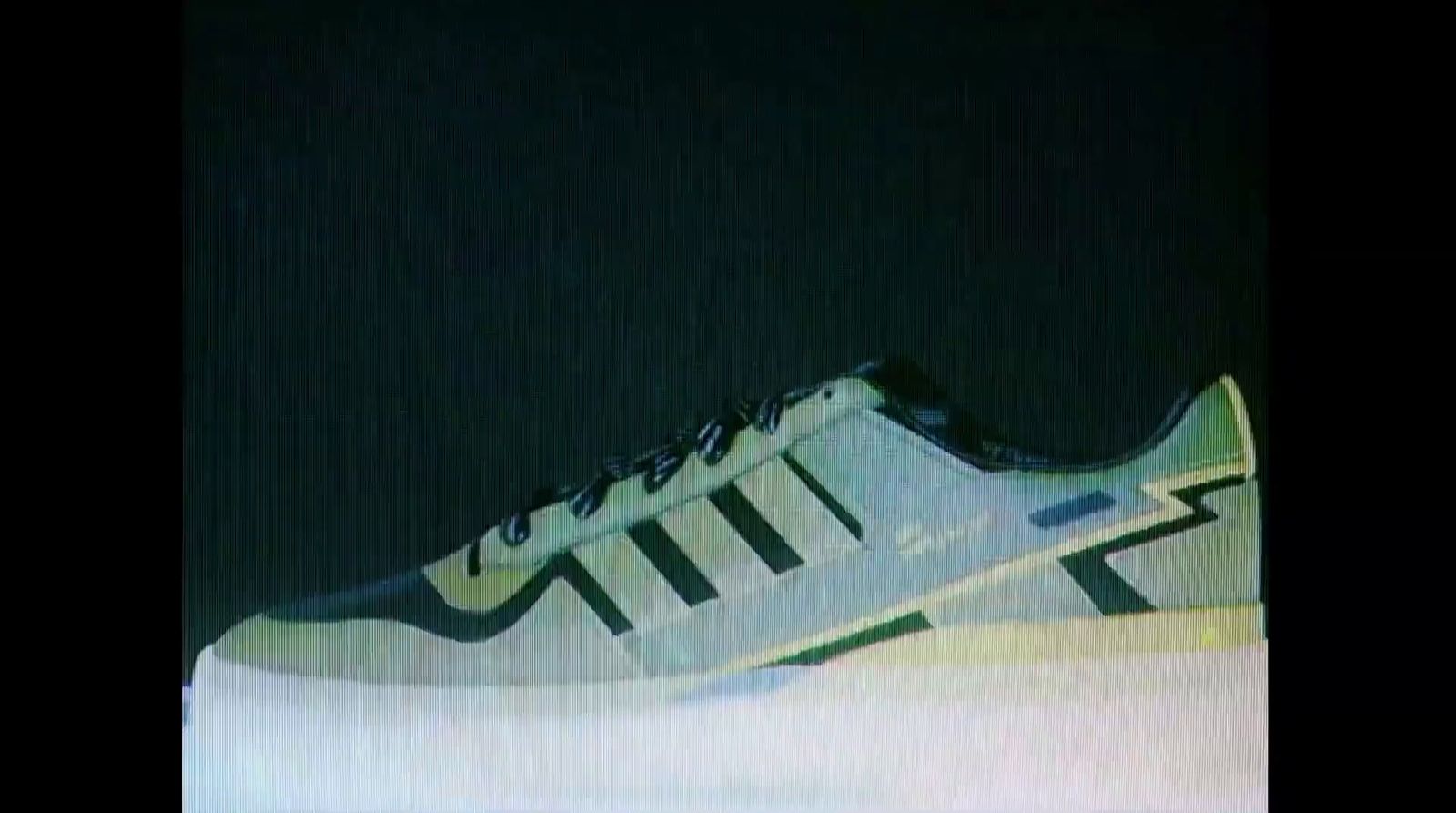 a pair of sneakers is shown in the dark