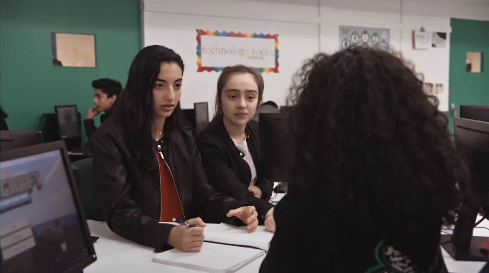 a group of people sitting around a table