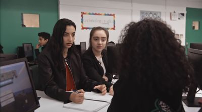 a group of people sitting around a table