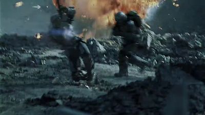 a group of soldiers running towards a huge explosion