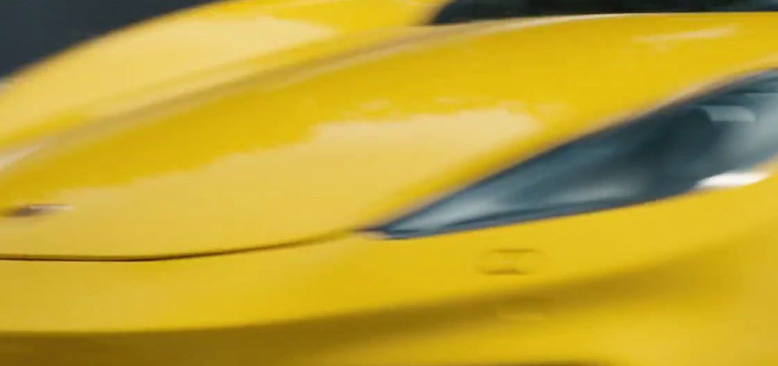 a close up of a yellow sports car