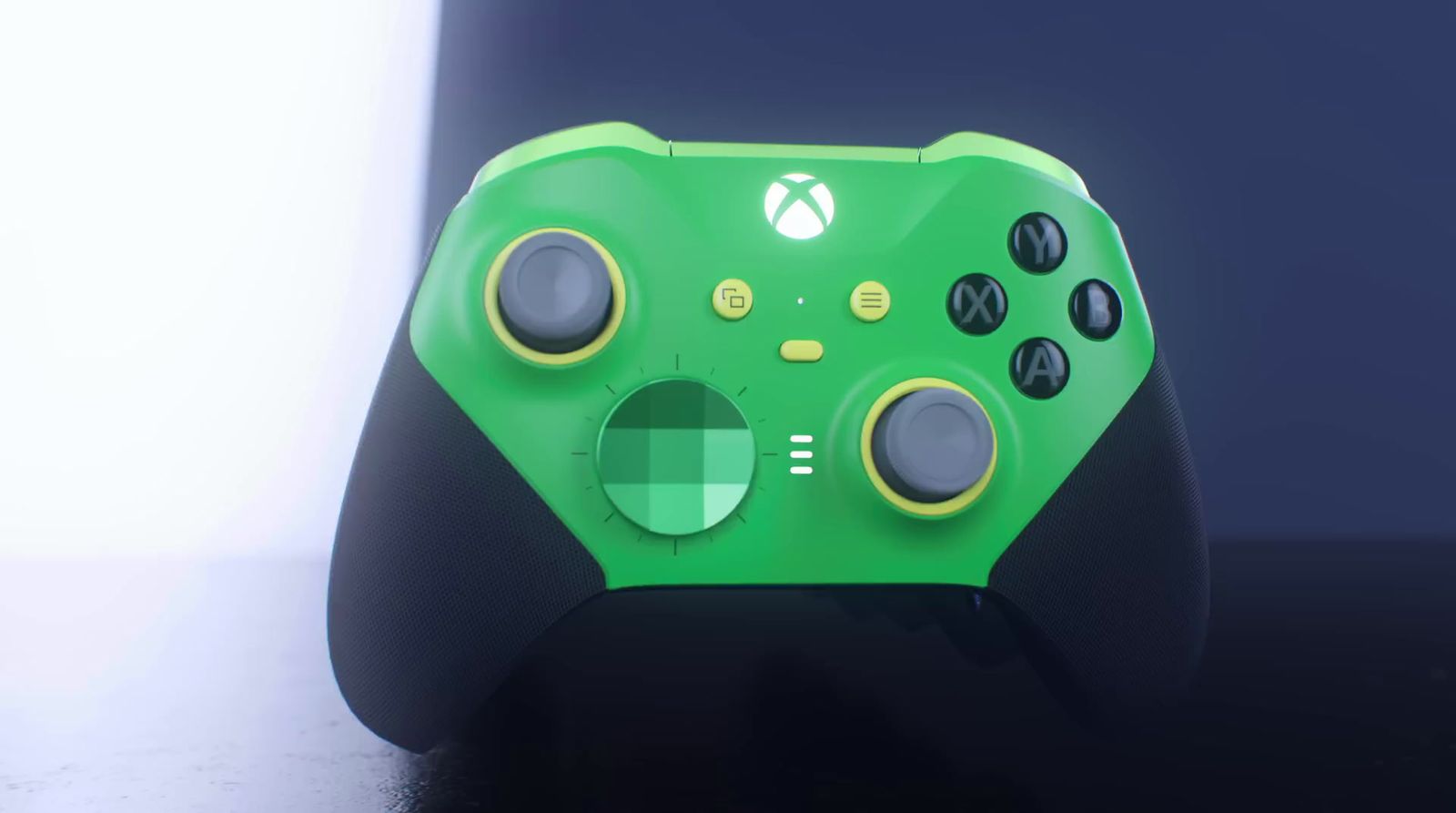 a close up of a green controller on a table