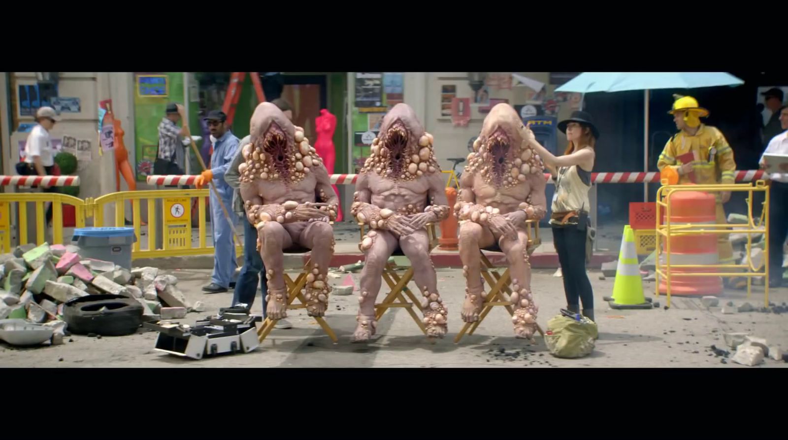 a group of three people sitting on top of a chair