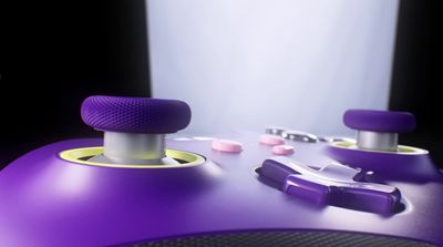 a close up of a purple video game controller