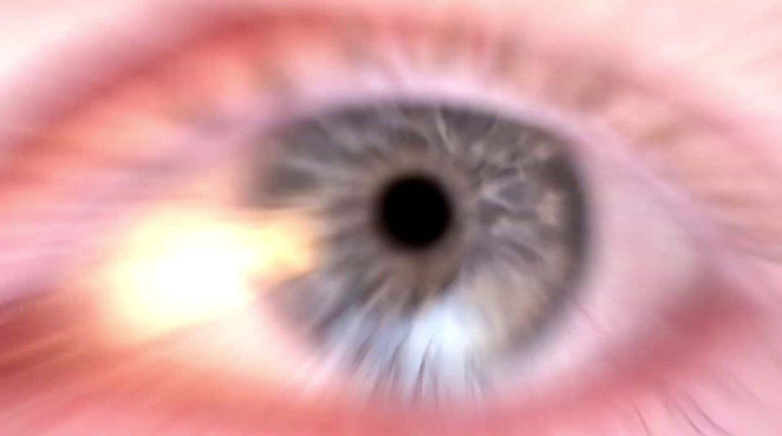 a close up of an eye with a blurry background