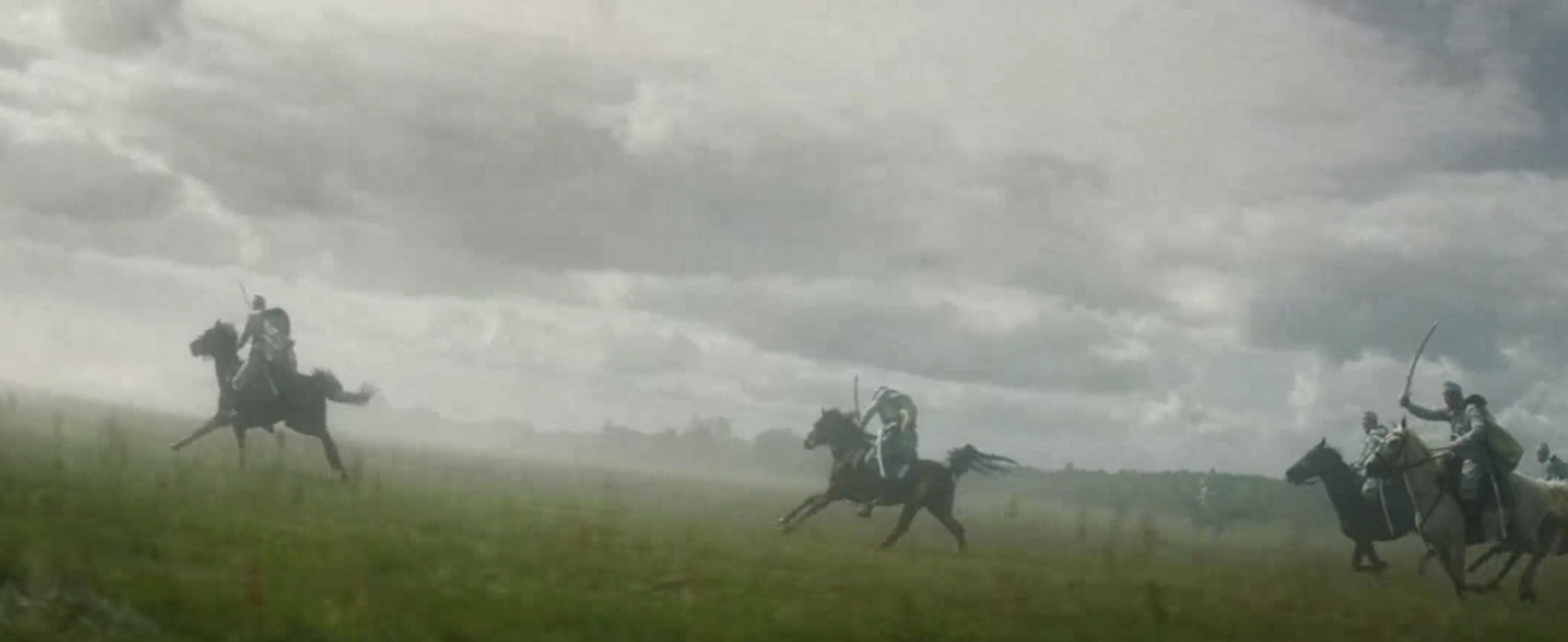 a group of men riding on the backs of horses