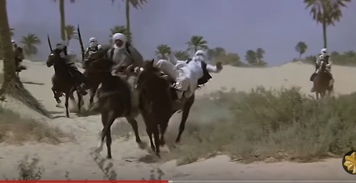 a group of men riding on the backs of horses