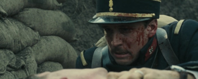 a man in a military uniform with blood on his face