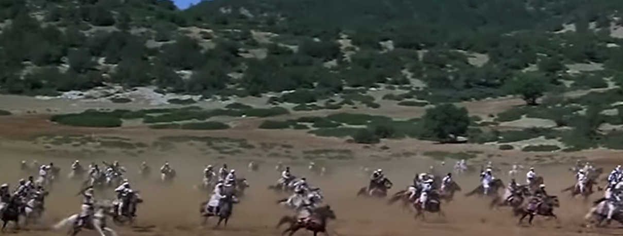 a group of people riding on the backs of horses