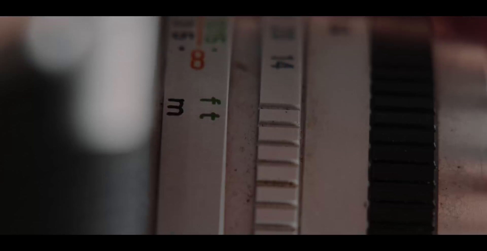 a close up of a thermometer with a blurry background