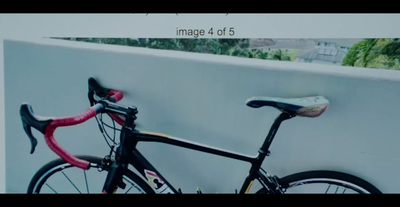 a close up of a bike parked against a wall