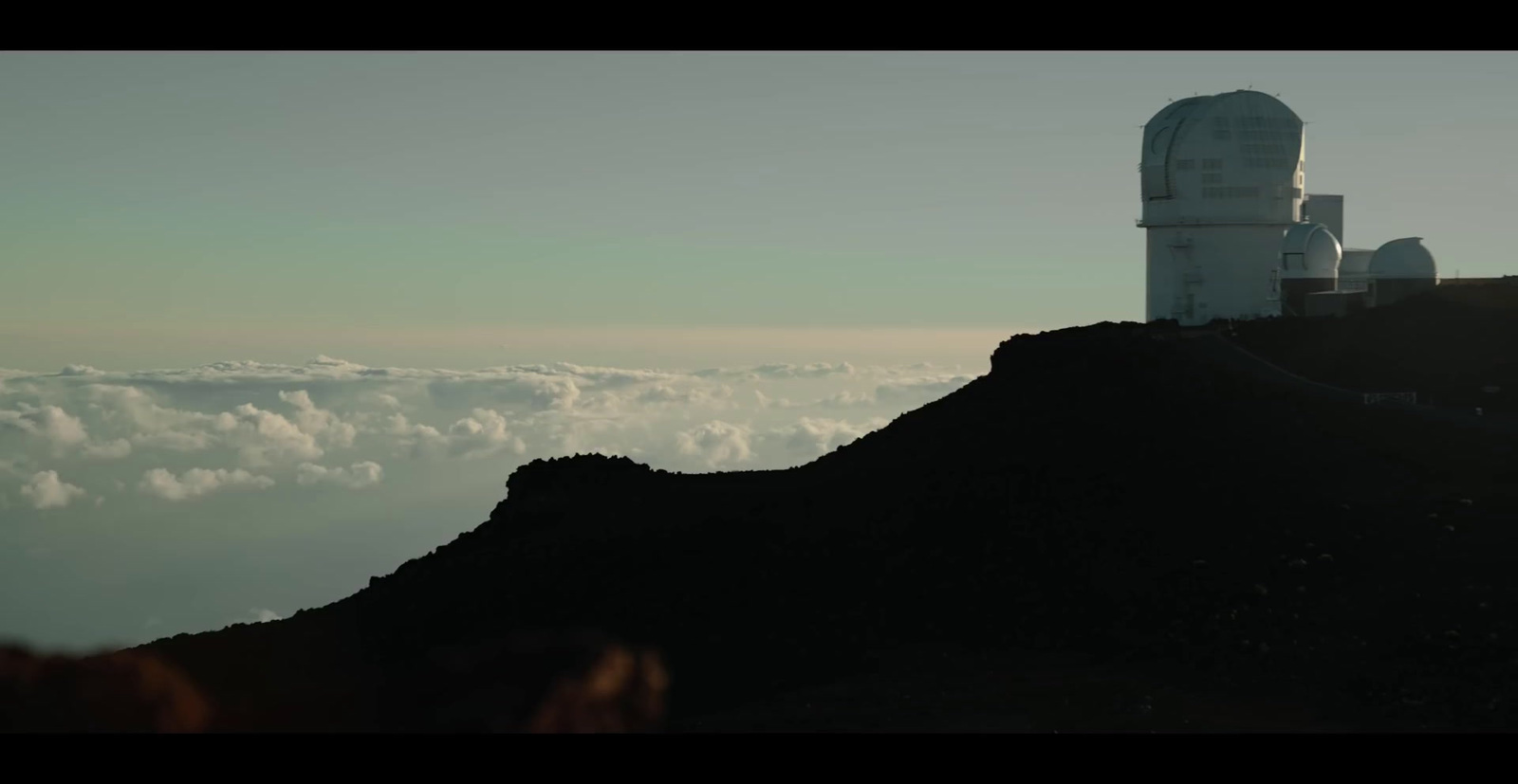 a hill with a tower on top of it