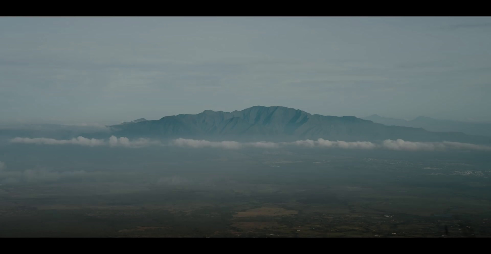 a view of a mountain from an airplane