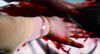 a person with blood all over their hands