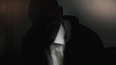 a blurry image of a man in a dark room