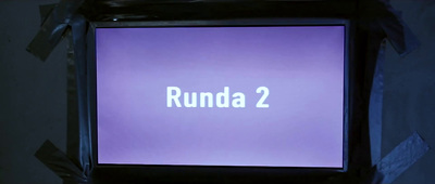 a purple screen with the words runda 2 on it