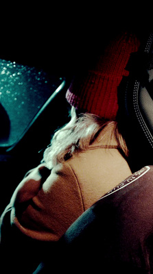 a person wearing a red hat sitting in a car