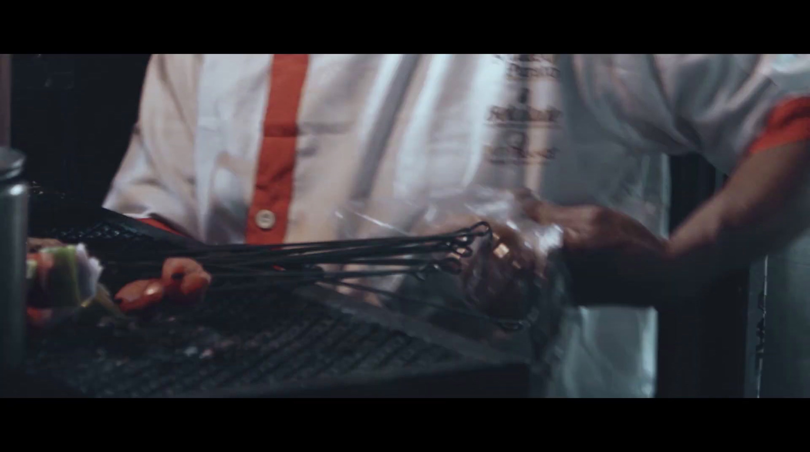 a man is preparing food in a kitchen