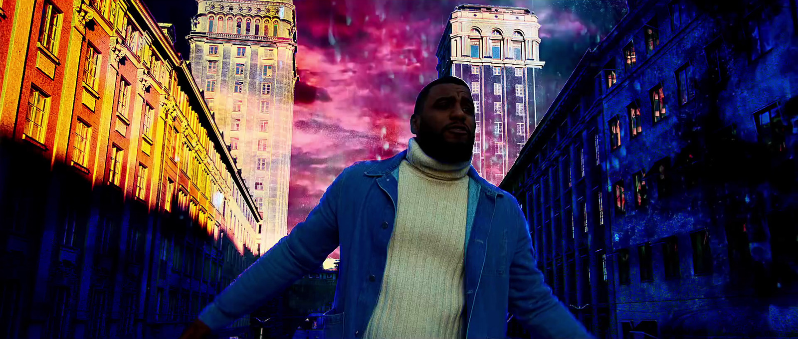 a man in a blue jacket is standing in a city