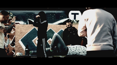 a group of people standing around a baseball field