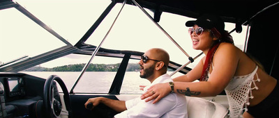 a man and a woman sitting on a boat