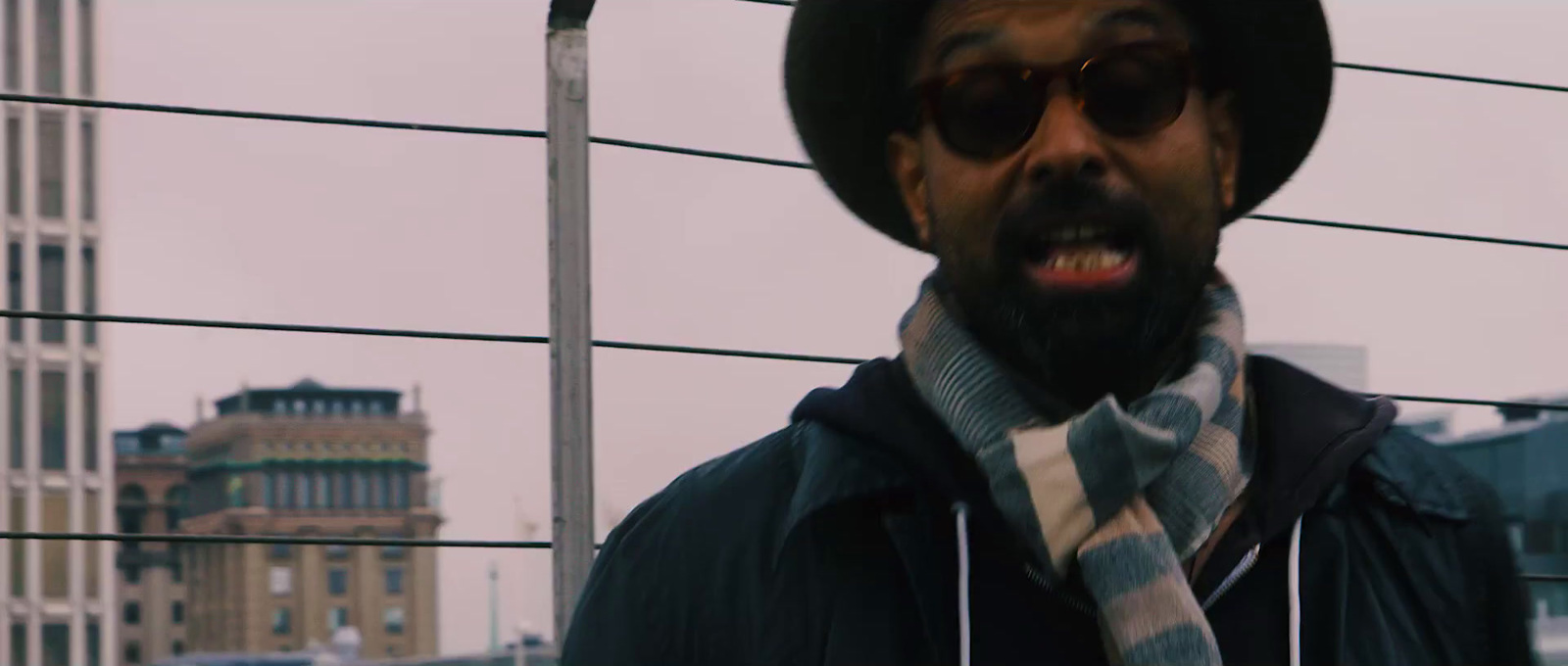 a man wearing a hat and a scarf