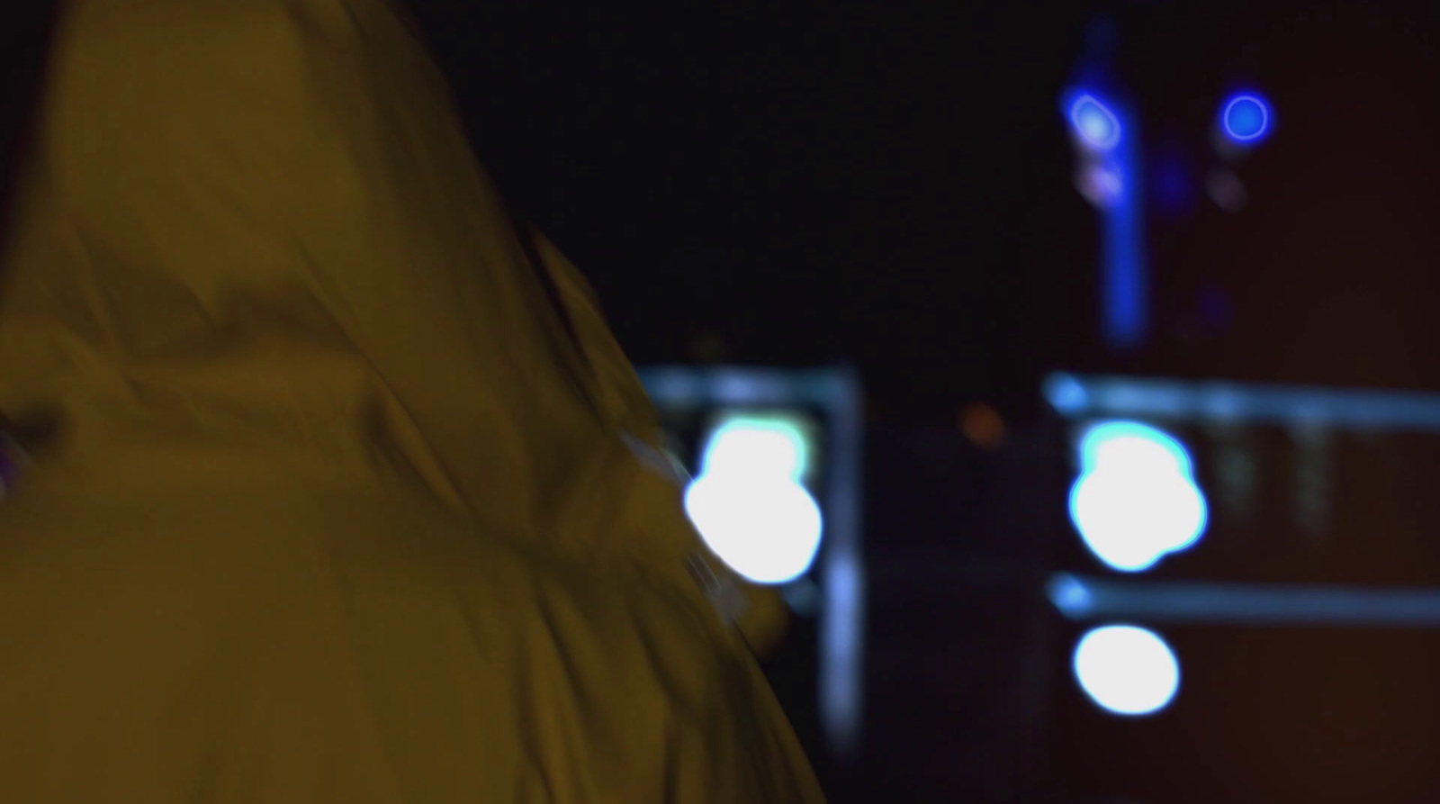 a blurry photo of a person in a yellow raincoat