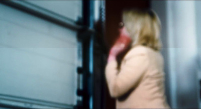 a blurry photo of a woman talking on a cell phone