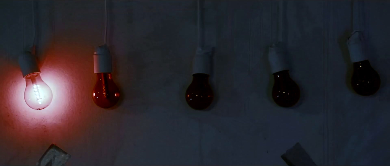 a group of light bulbs hanging from a wall