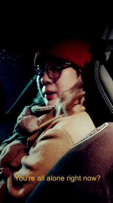 a woman sitting in the back seat of a car