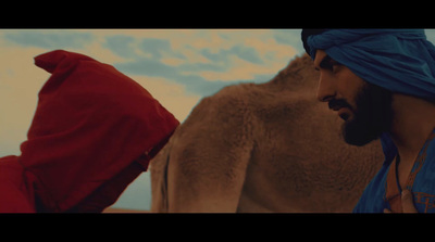 a man in a blue turban and a man in a red shawl