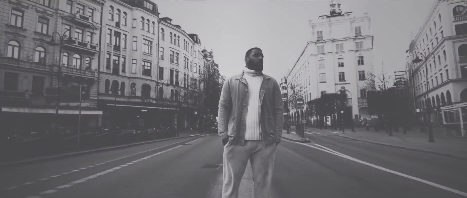 a man standing in the middle of a street