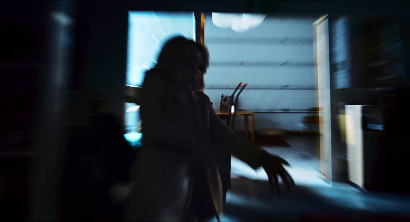 a blurry image of a person in a room