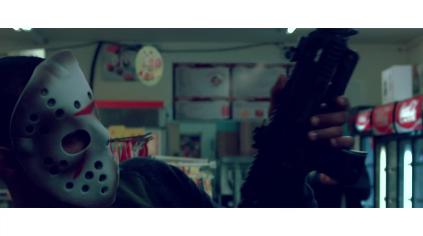 a person wearing a mask holding a gun