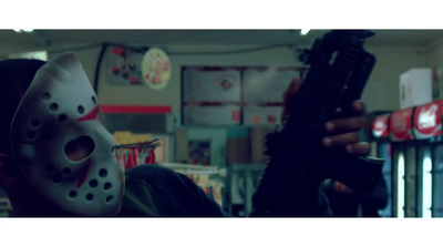a person wearing a mask holding a gun