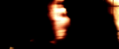 a blurry image of a person standing in a room