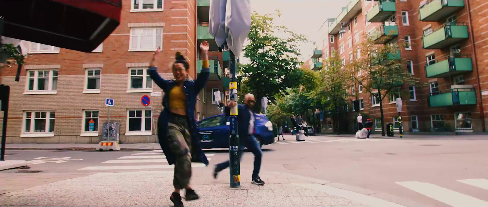 a group of people standing on the side of a road