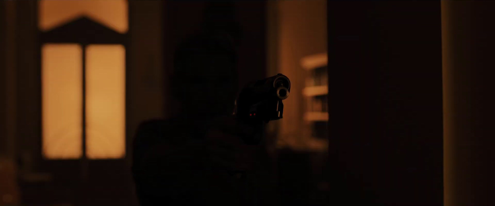 a person holding a camera in a dark room