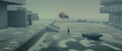 a man standing on top of a snow covered roof