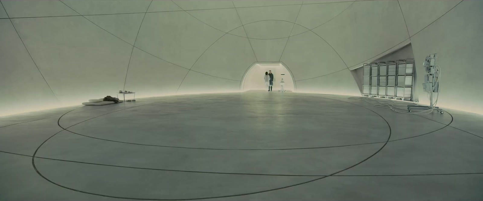 a man standing in a room with a circular floor