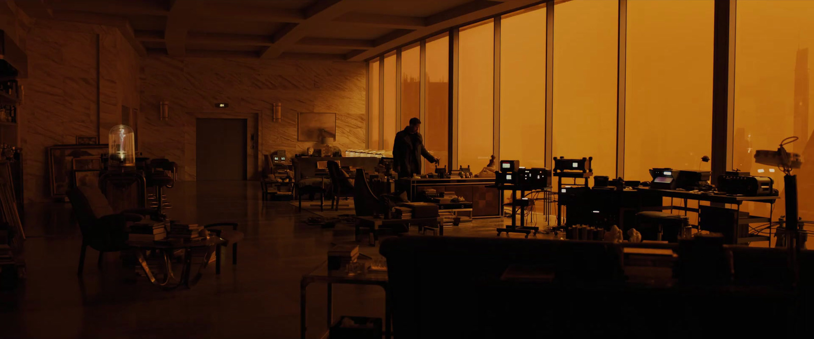 a man is walking through a dimly lit room