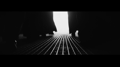 a black and white photo of a train track