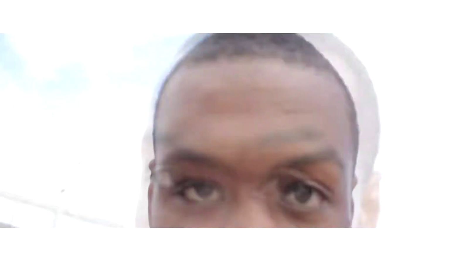 a close up of a person's face with a blurry background