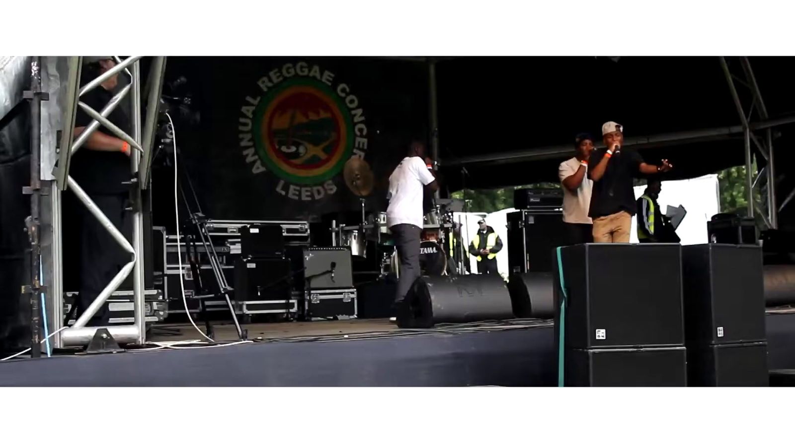 a group of men standing on top of a stage